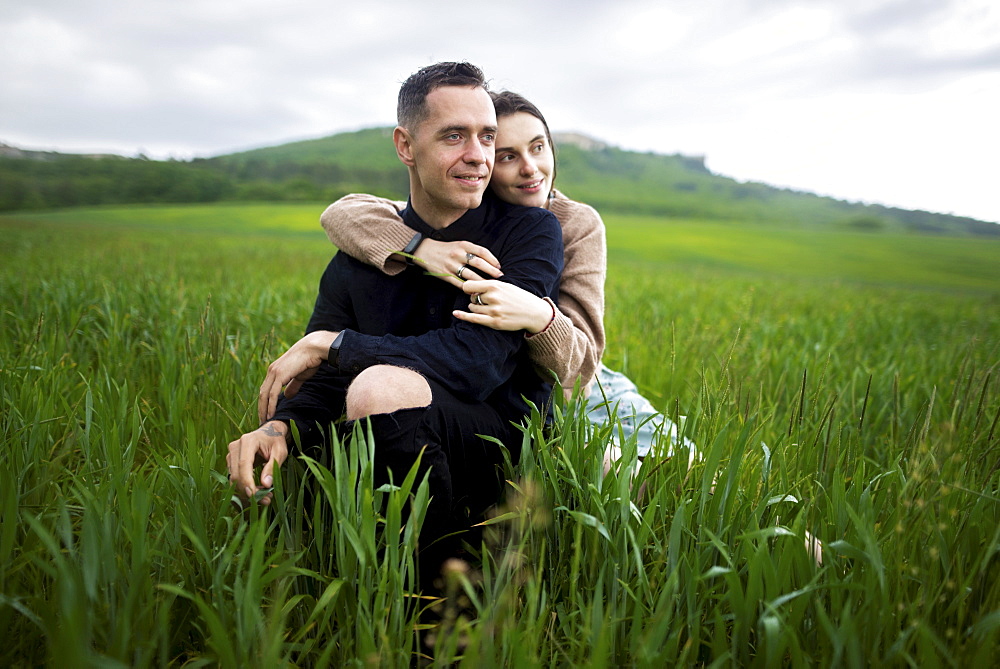 Young couple embracing in wheat field