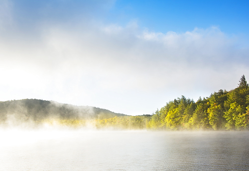 Usa, New York State, North Elba, Morning fog over Placid Lake