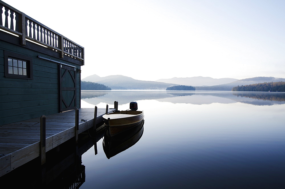 Usa, New York, North Elba, Wooden boat docked on Lake Placid