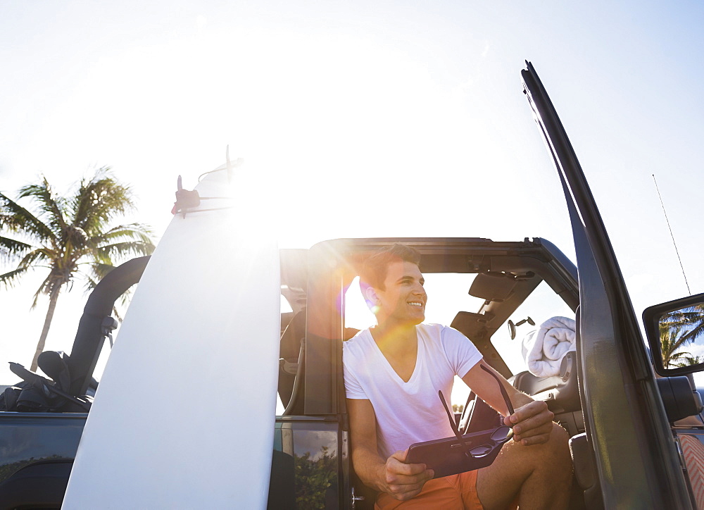 Young man using digital tablet, Jupiter, Florida, USA