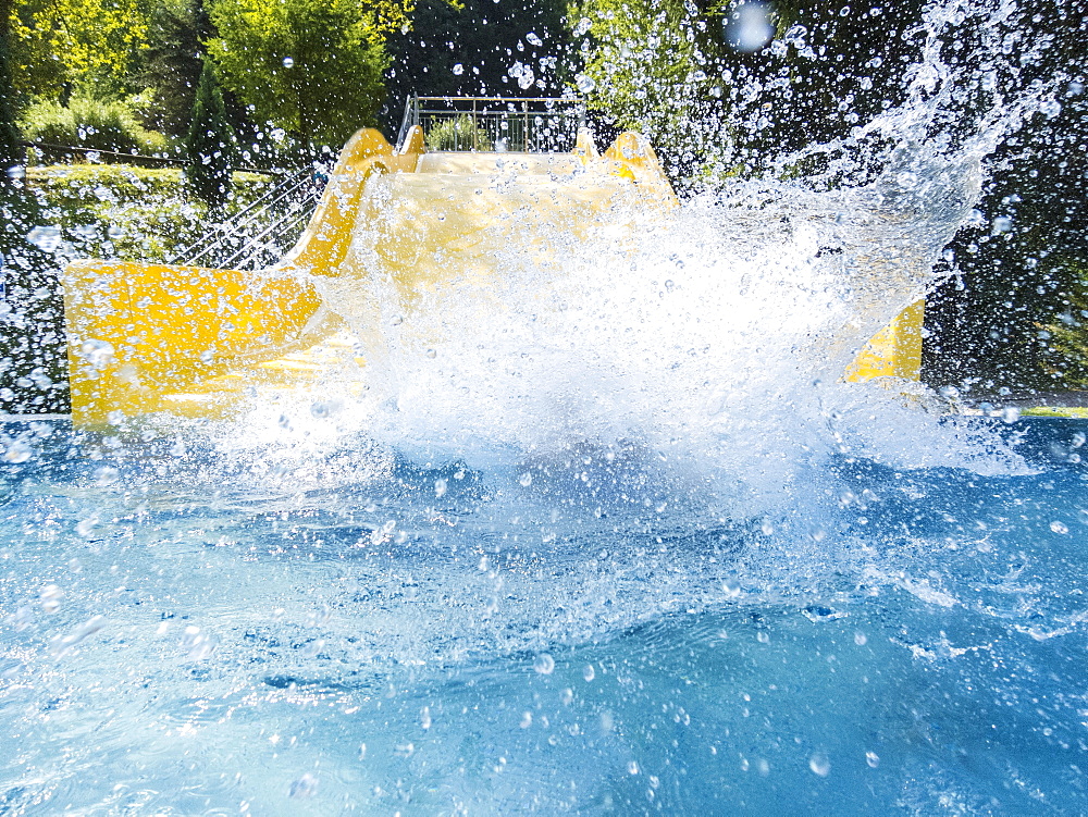 Boy (6-7) making splash in pool, Germany, Thuringia