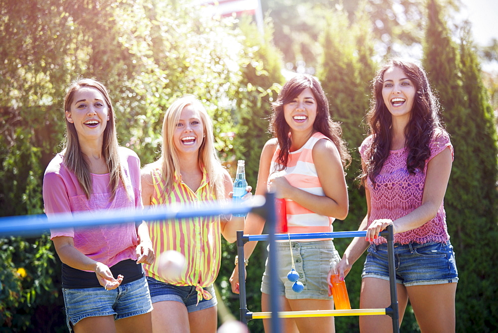 Portrait of young women throwing balls, USA, Washington, Bellingham 