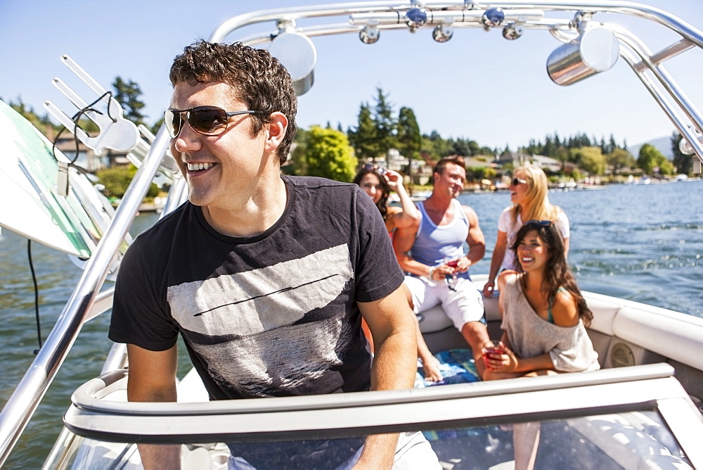 Young people enjoying speedboat ride, USA, Washington, Bellingham