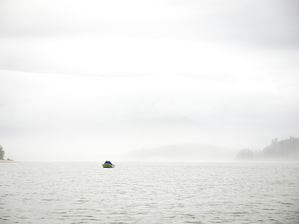 Distant view of people in boat, Rockaway Beach, Oregon