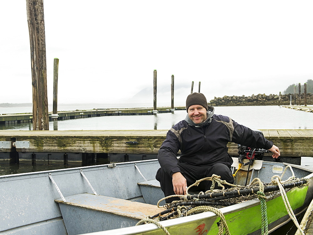 Portrait of man in boat, Rockaway Beach, Oregon