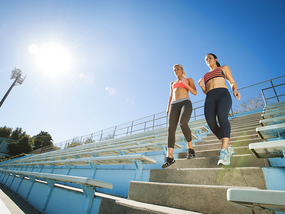 Two women walking down steps, USA, California, Los Angeles