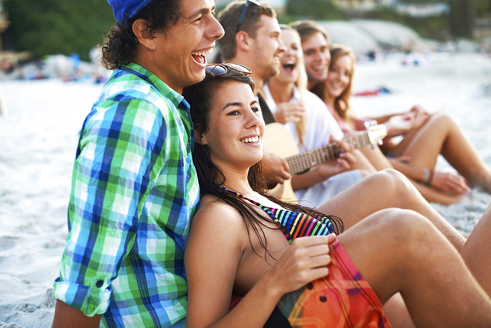 Group of friends relaxing at beach