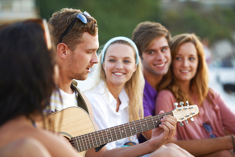 Group of friends relaxing at beach