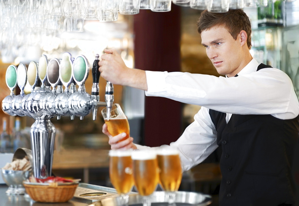 Bartender pouring beer