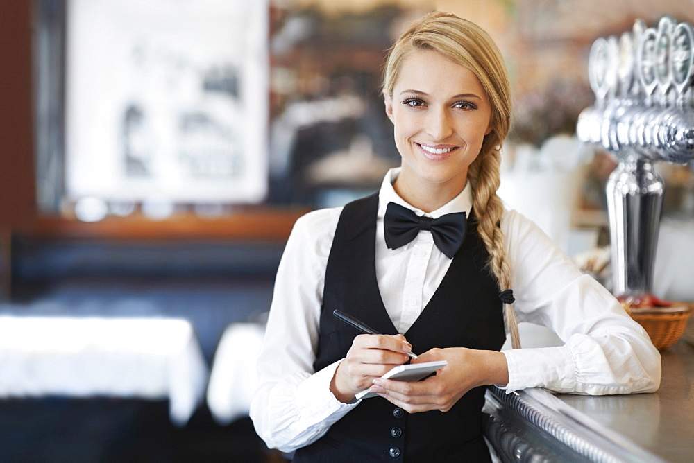 Portrait of smiling waitress