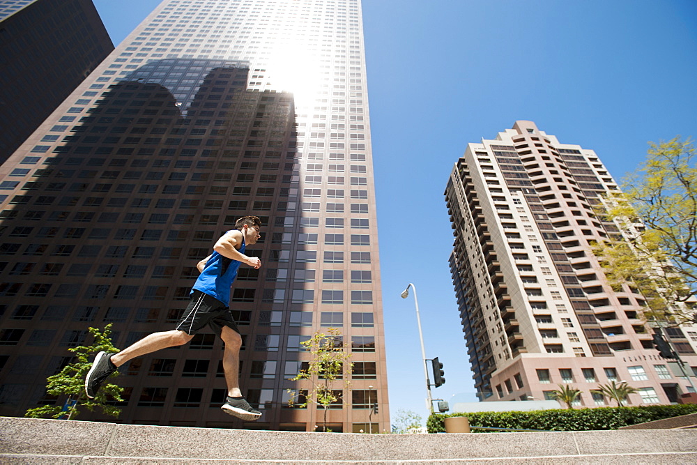 USA, California, Los Angeles, Young man running in city, USA, California, Los Angeles