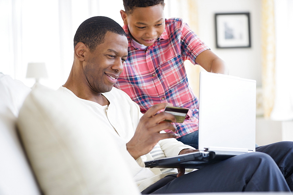 Father and son shopping online