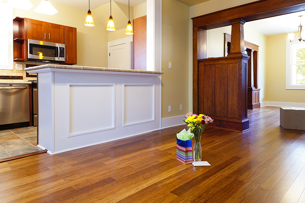 Flowers and gift on floor in new house