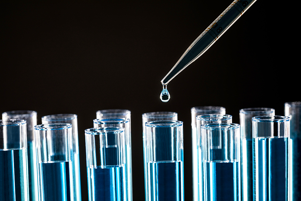 Pipette dropping liquid into test tube