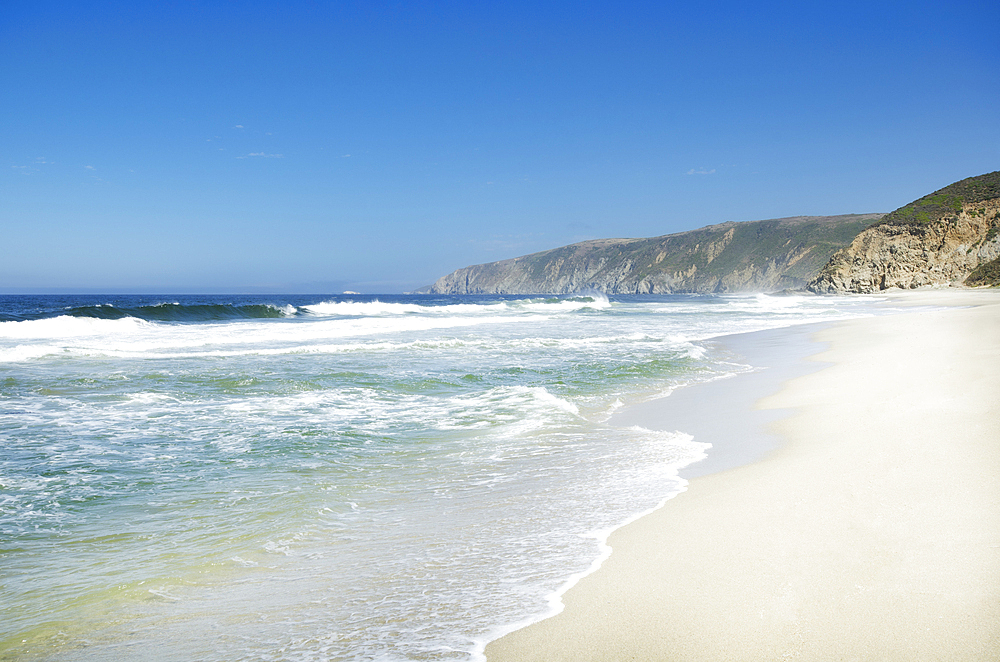 Sea waves on sandy beach