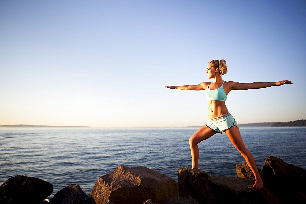 Athletic woman stretching outdoors