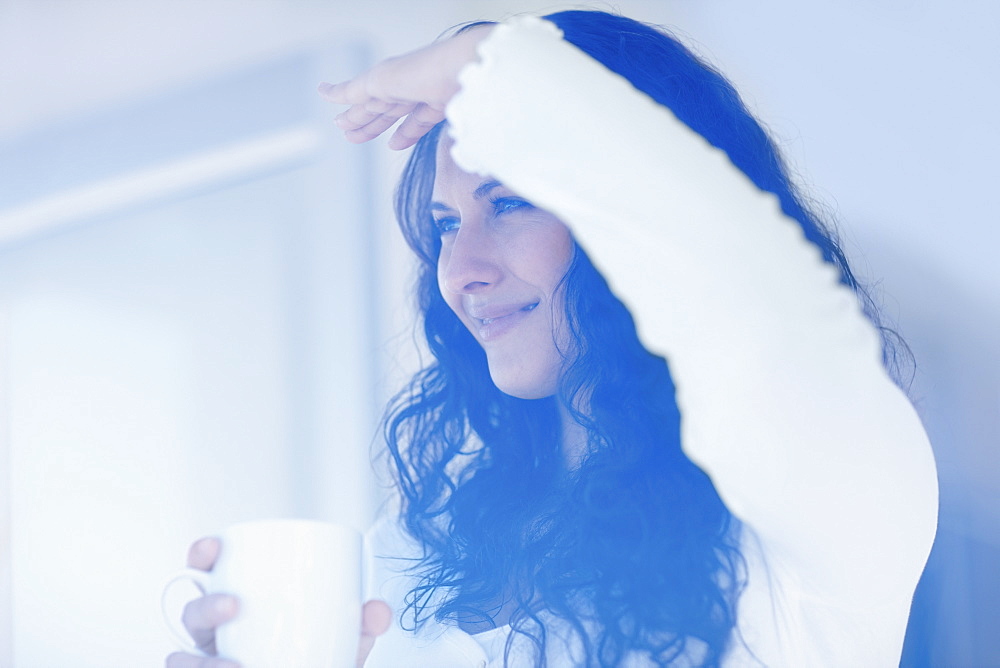 Woman looking out window