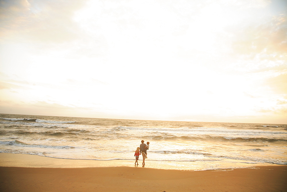 Mother and children watching sunset