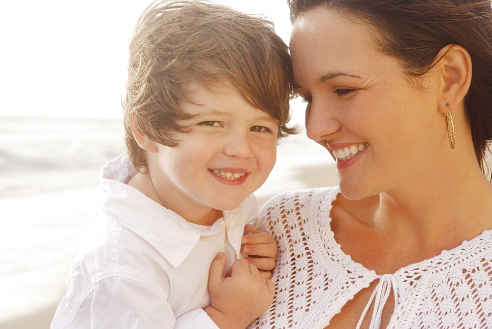 Close up of mother and son smiling