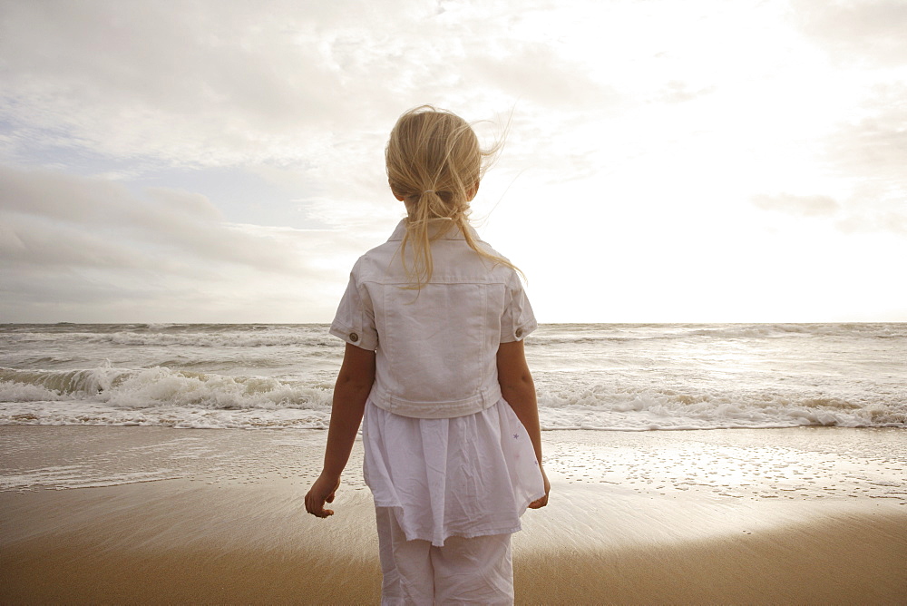 Girl looking out at ocean