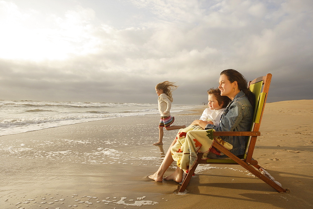 Mother and children at beach