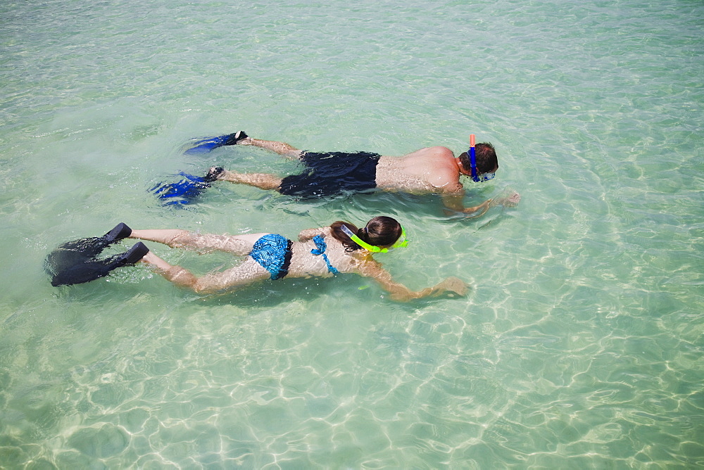 Father and daughter snorkeling in water, Florida, United States