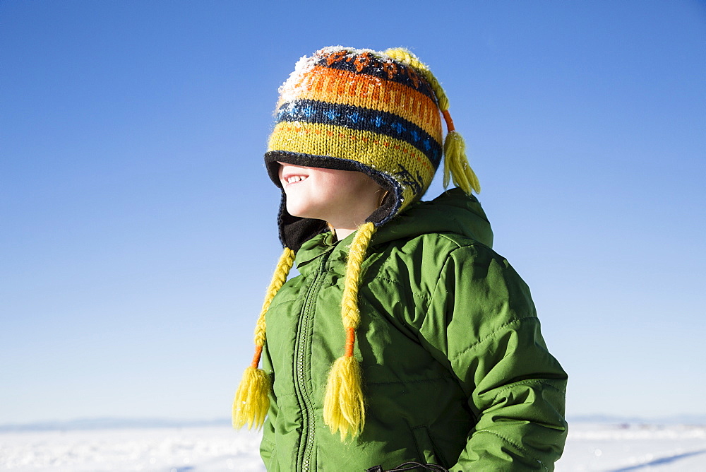 Boy (4-5) enjoying winter outdoors