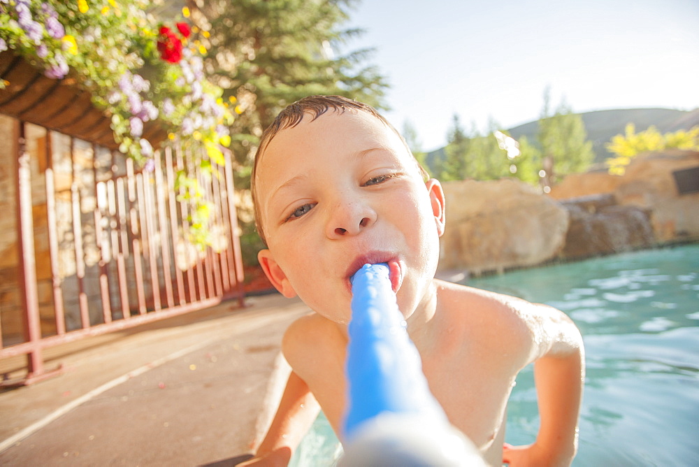 Boy (4-5) posing in swimming pool, USA, Utah, Park City 