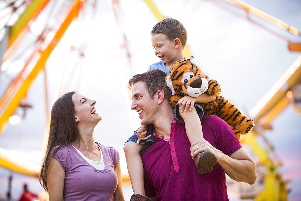 Happy Family with son (4-5) in amusement park, USA, Utah, Salt Lake City 