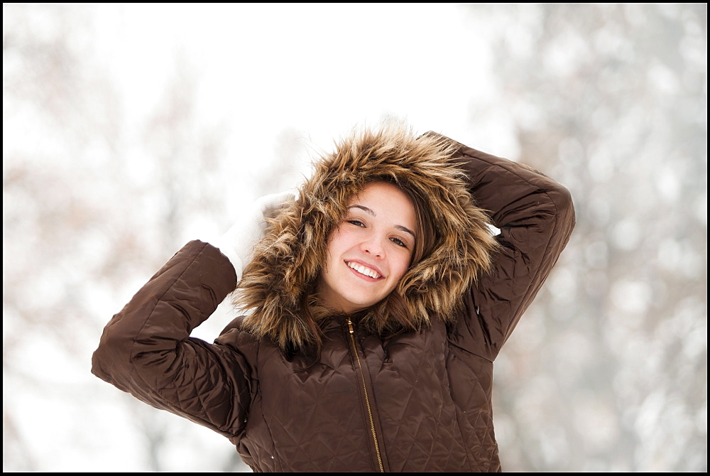 USA, Utah, Lehi, Portrait of young woman wearing winter coat outdoors