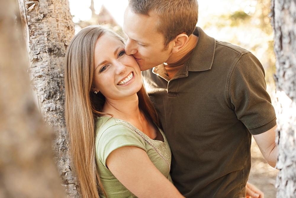 Man kissing his girlfriend