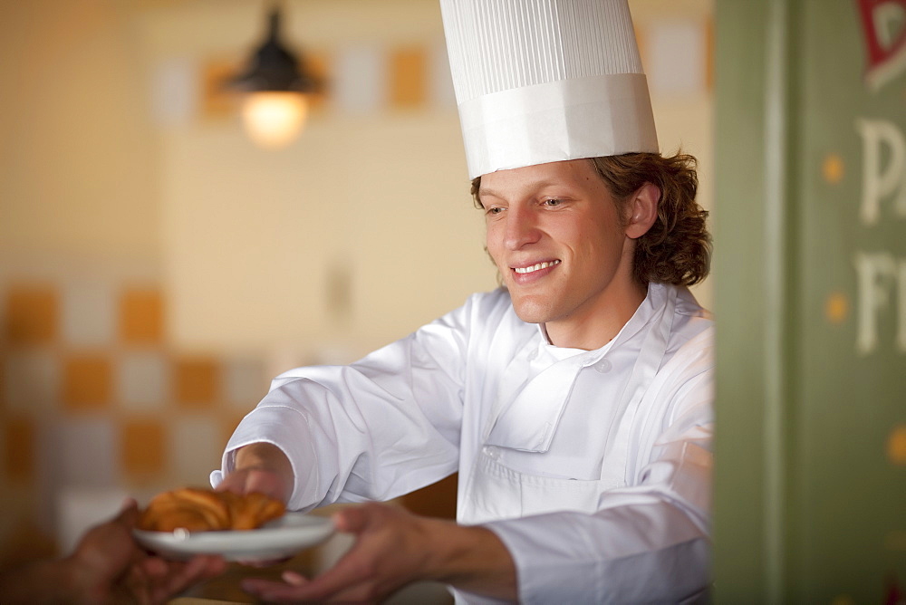 Chef serving pastry