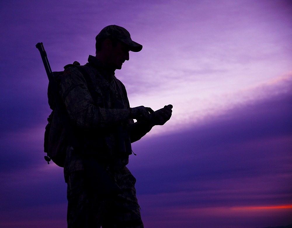 Big game hunter at dusk