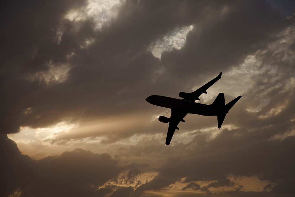 Commercial jet in cloudy sky