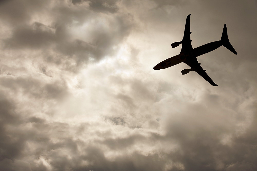 Commercial jet in cloudy sky