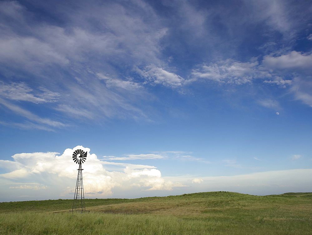Windmill in field