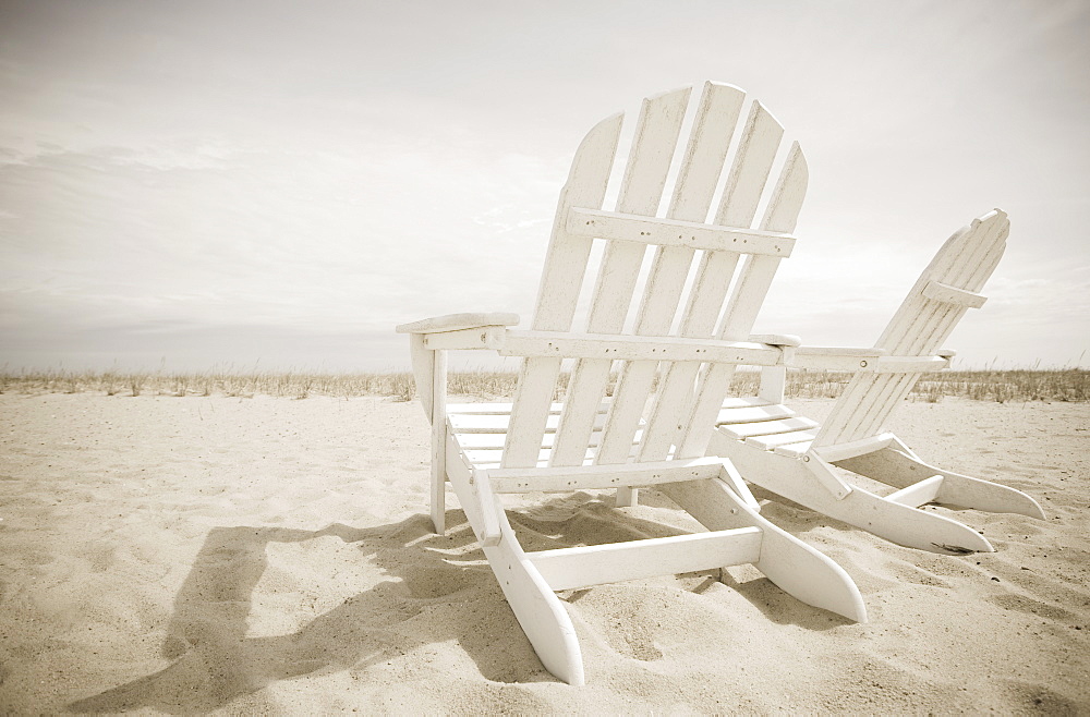 Adirondack chairs on the beach