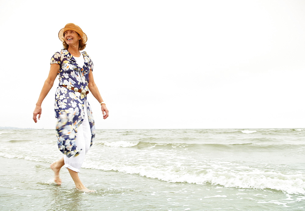 Woman walking on the beach