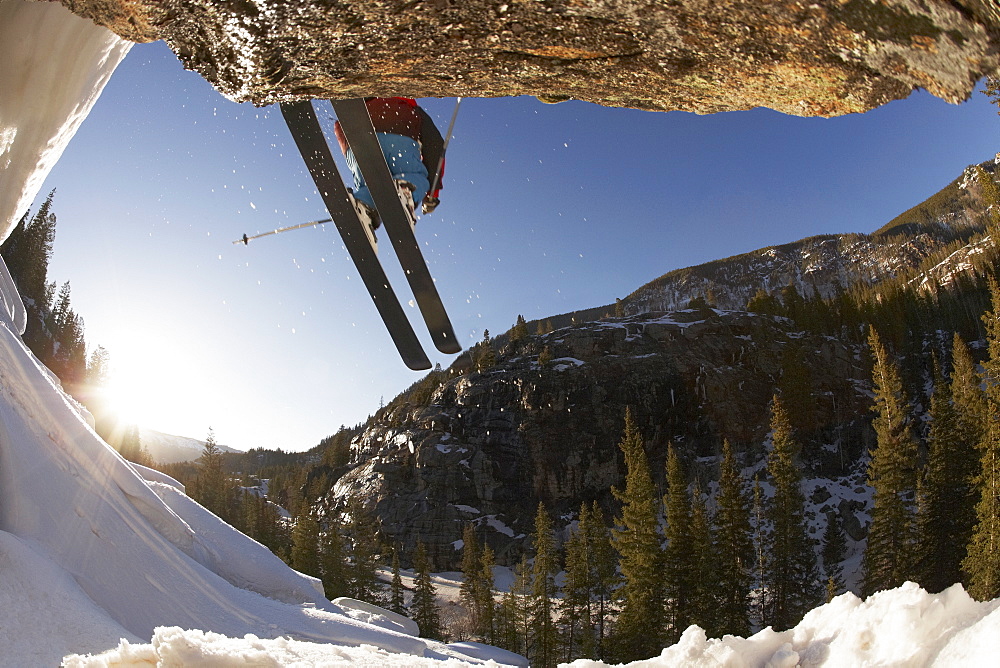 Skier mid jump in Aspen Colorado