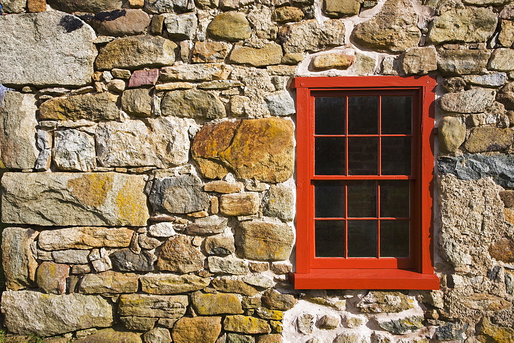 Window on stone barn wall