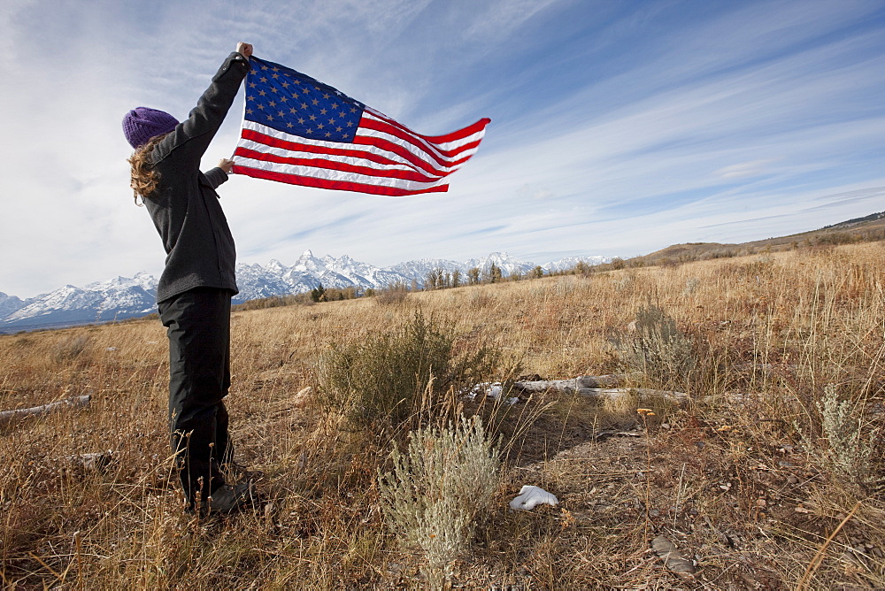 Hiker holding American flag