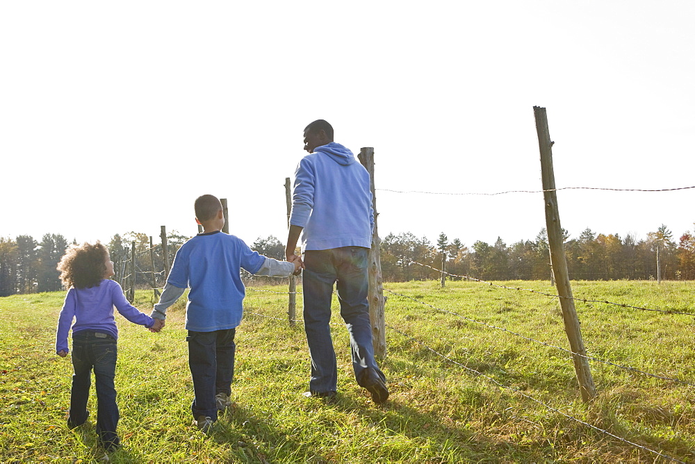 Father and children walking