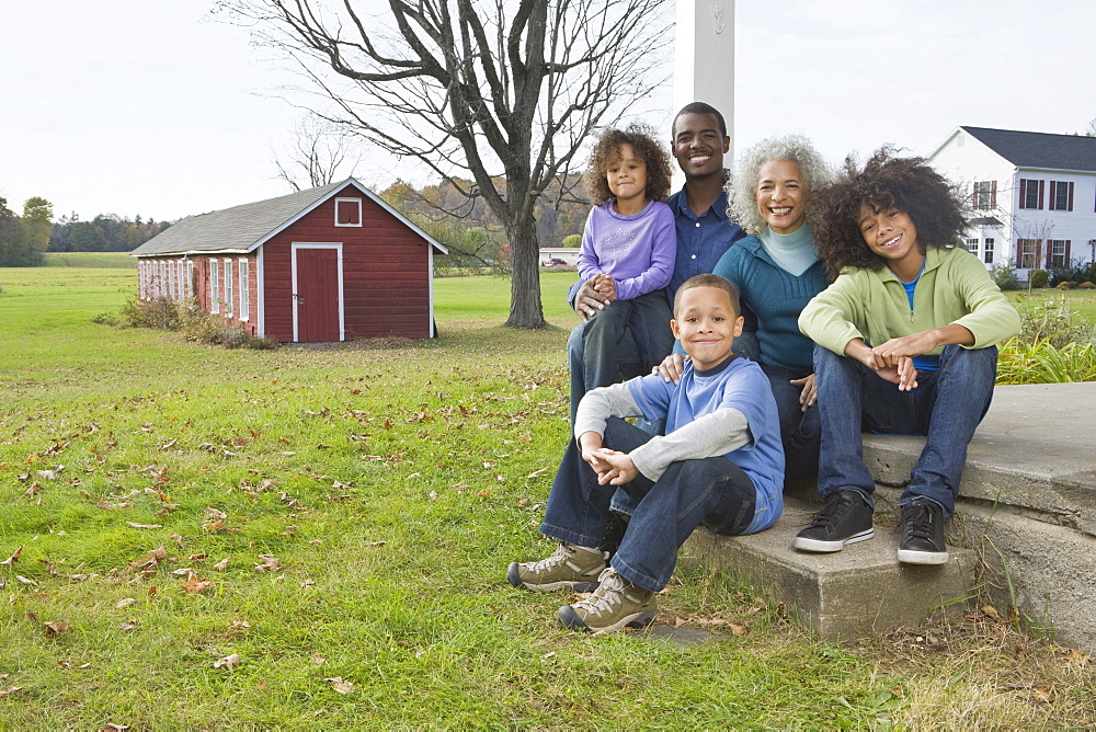 Family sitting on porch