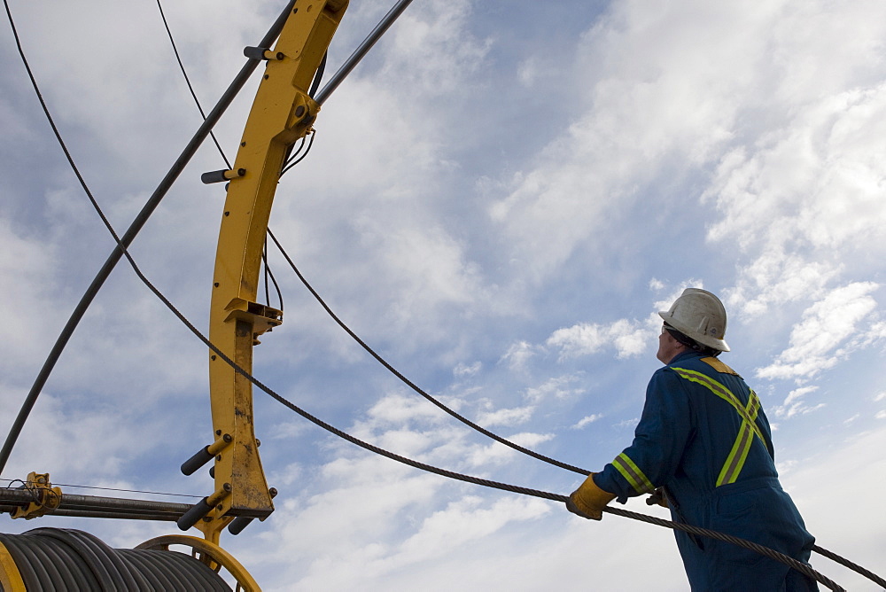 Man working with drilling equipment