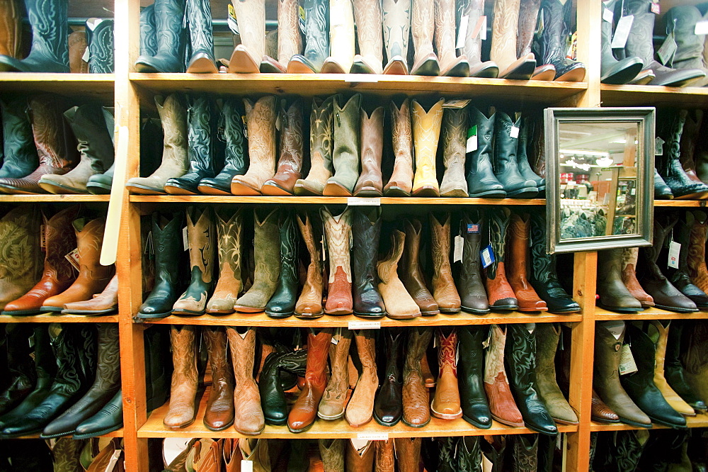 Boot in row on shelves in shop, Aspen, Colorado, USA 