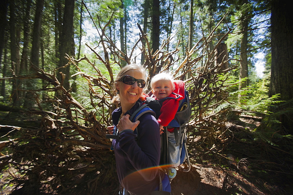 Woman with son (4-5) on trail of cedars, Trail of the cedars,Glacier National Park, Montana, USA