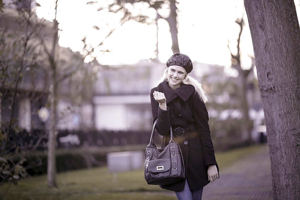 Smiling woman walking in park, Tilburg, The Netherlands