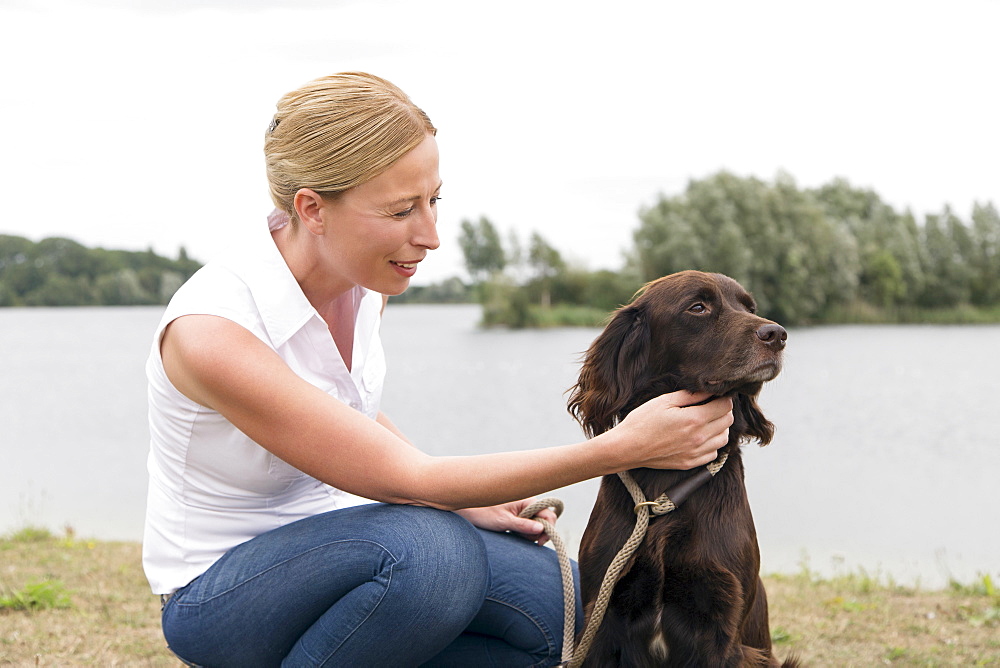 Portrait of woman with dog, Netherlands