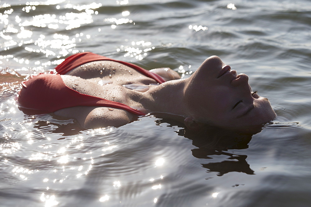 Woman relaxing in lake