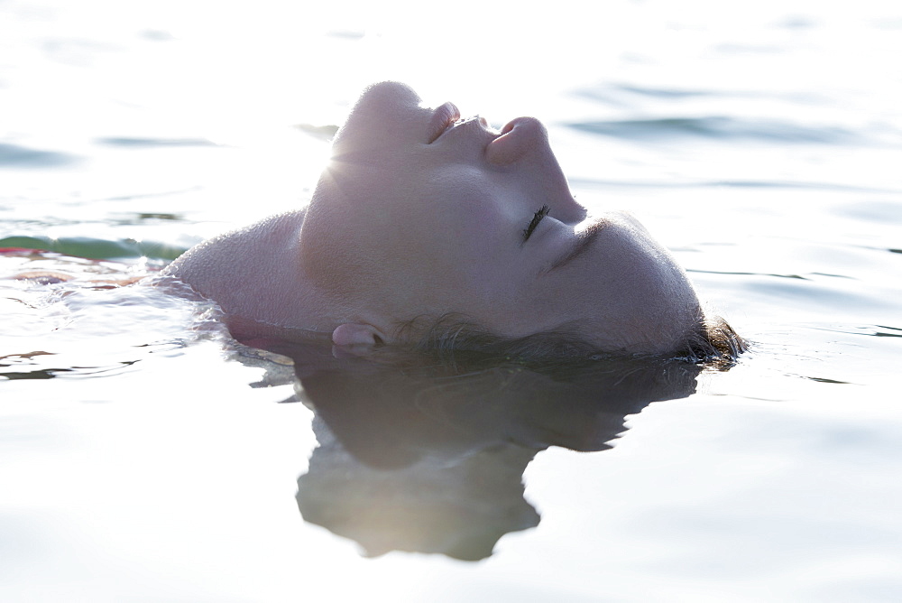 Woman relaxing in lake